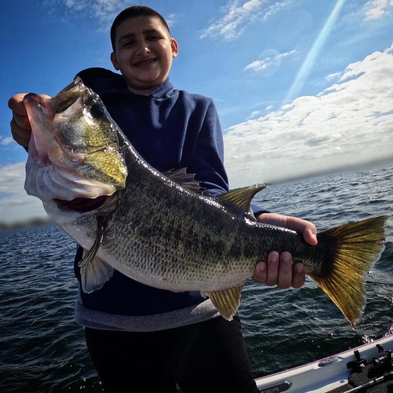 big bass guide florida fishing boy catches