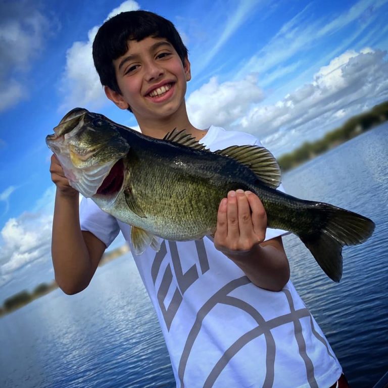 big bass guide florida fishing happy boy